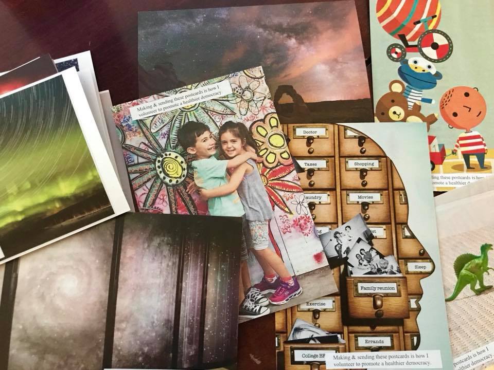 Several postcards showing: an aurora borealis, two children embracing, a galaxy, and the profile of a person.