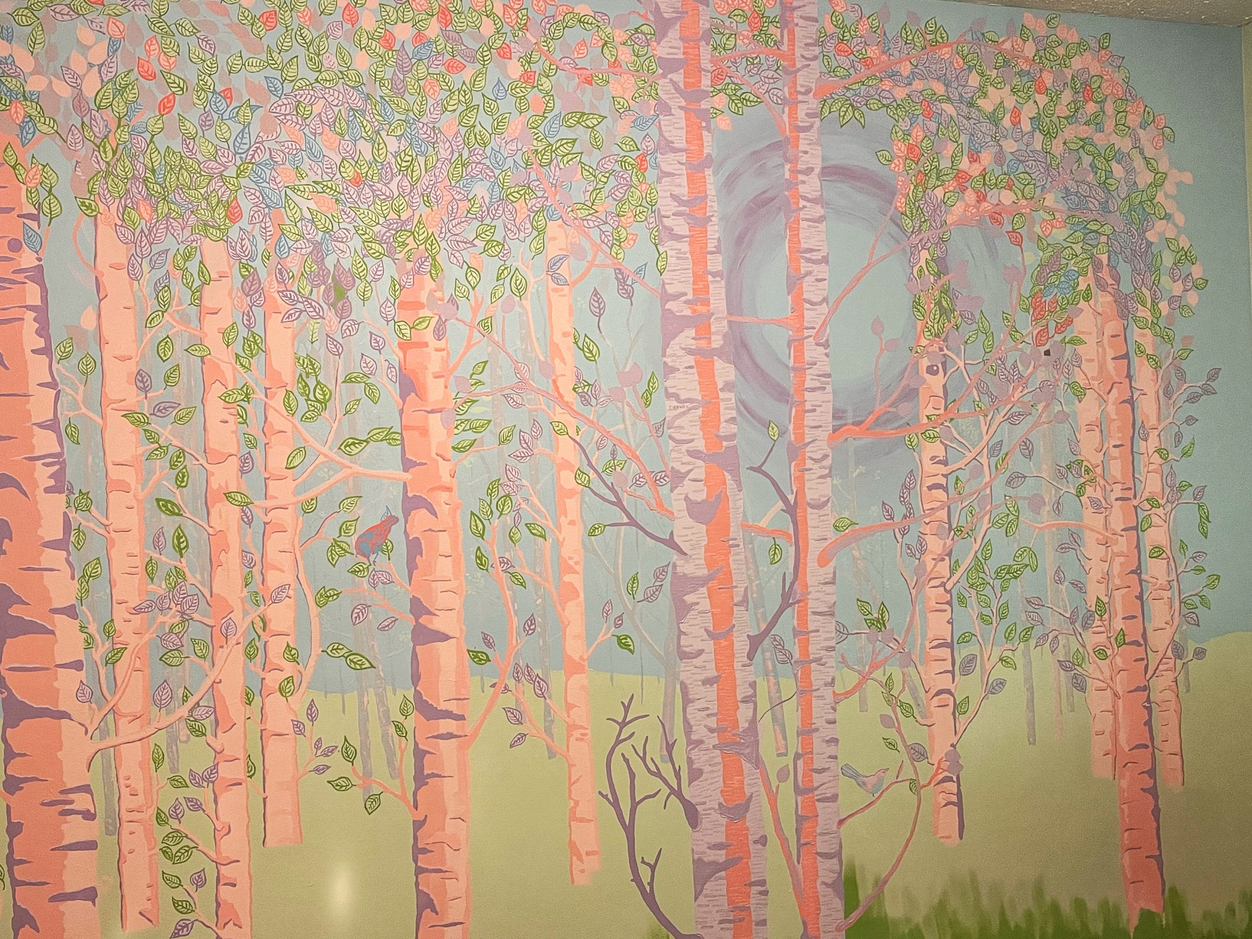 Unfinished mural of a fantasy forest in pinks and purples with some green and blue.
