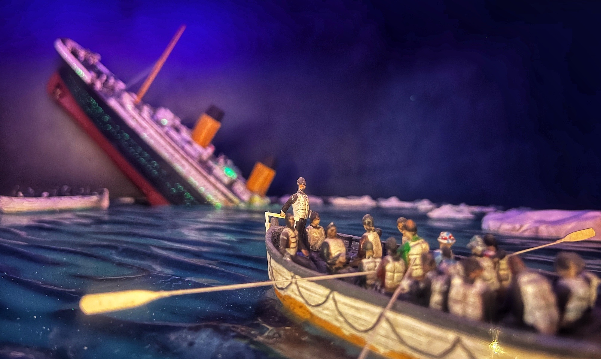 Titanic sinking with a boat in the foreground full of rescued people